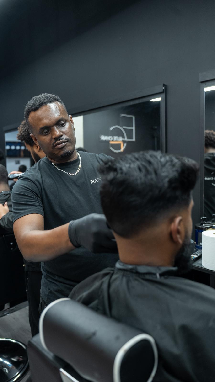 Elite Chair Barber finishing a clean haircut